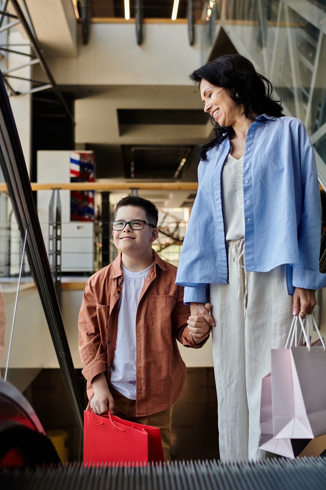 Mother and son with down syndrome enjoying a shopping mall excursion